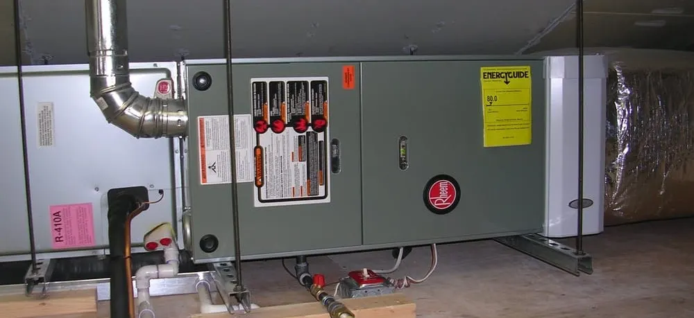 Horizontal gas furnace and air handler installed in an attic