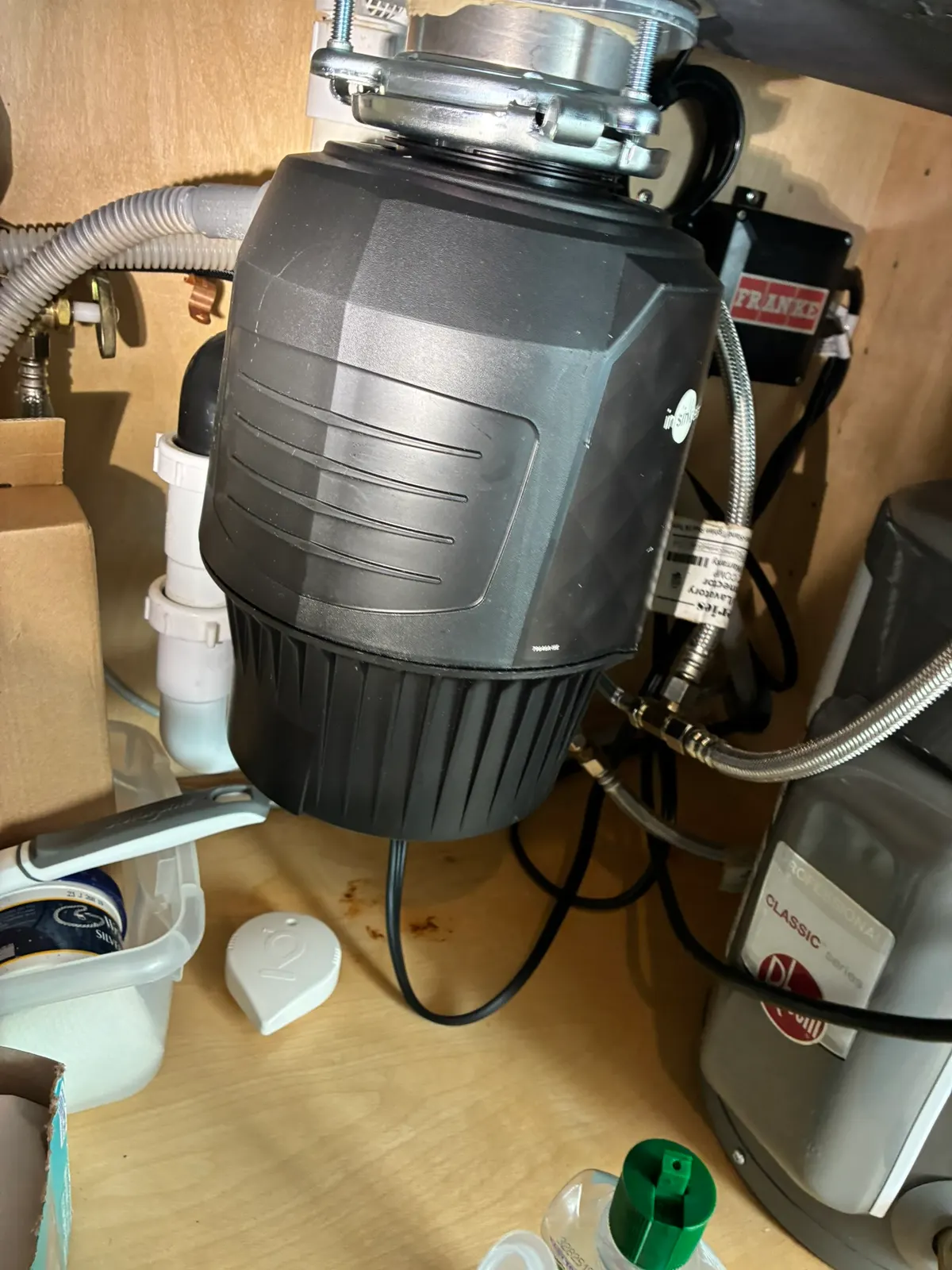 Kitchen sink plumbing and garbage disposal components