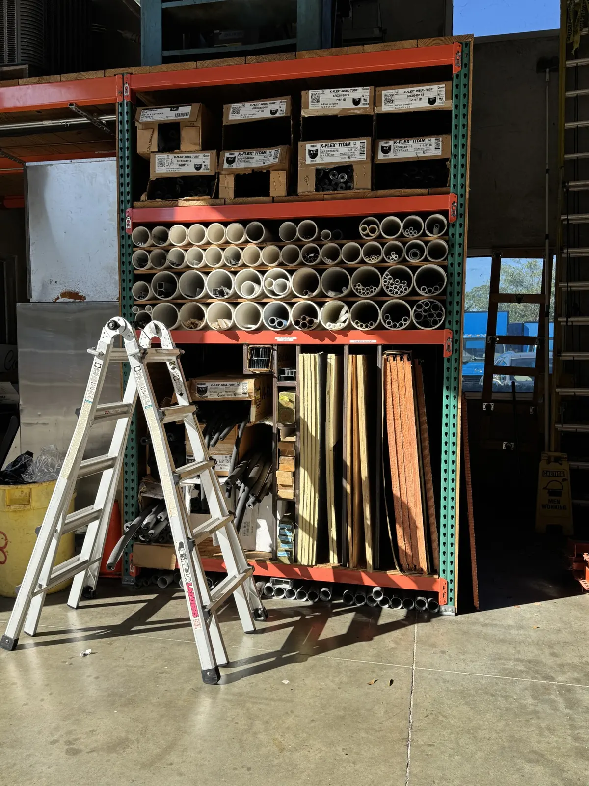 Commercial plumber working inside an industrial facility