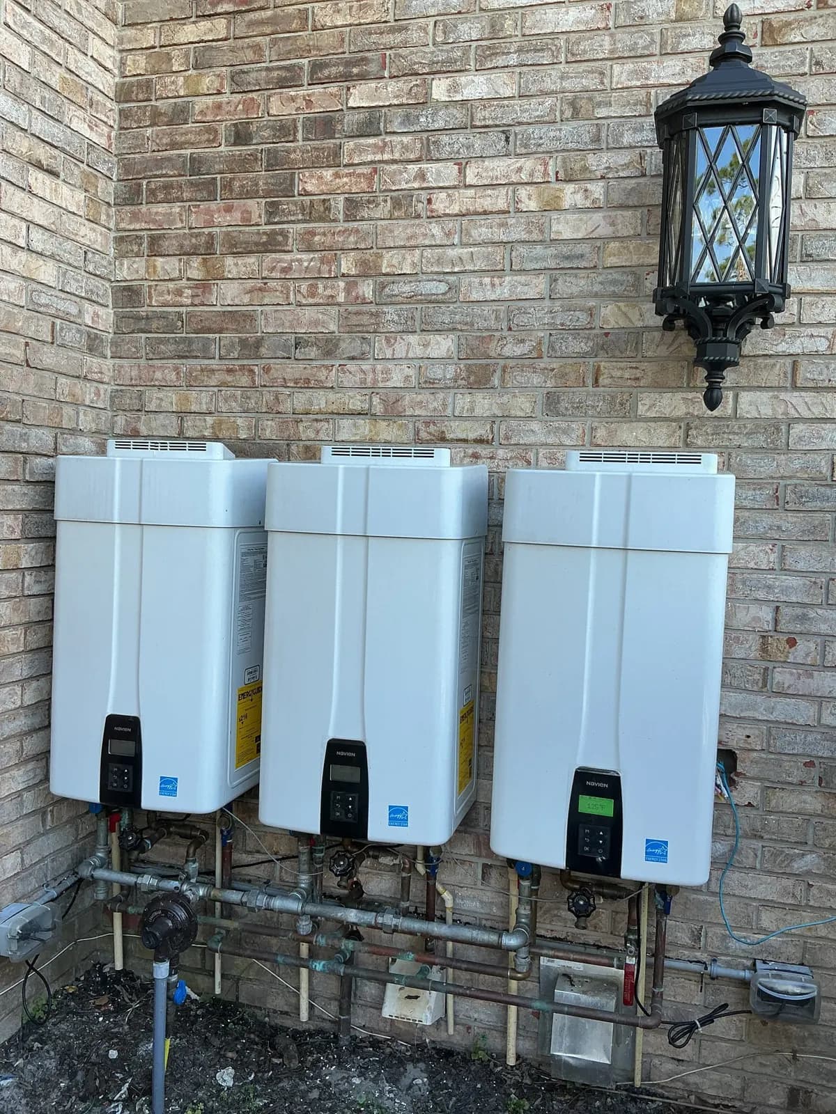 Tankless water heaters installed outside a home