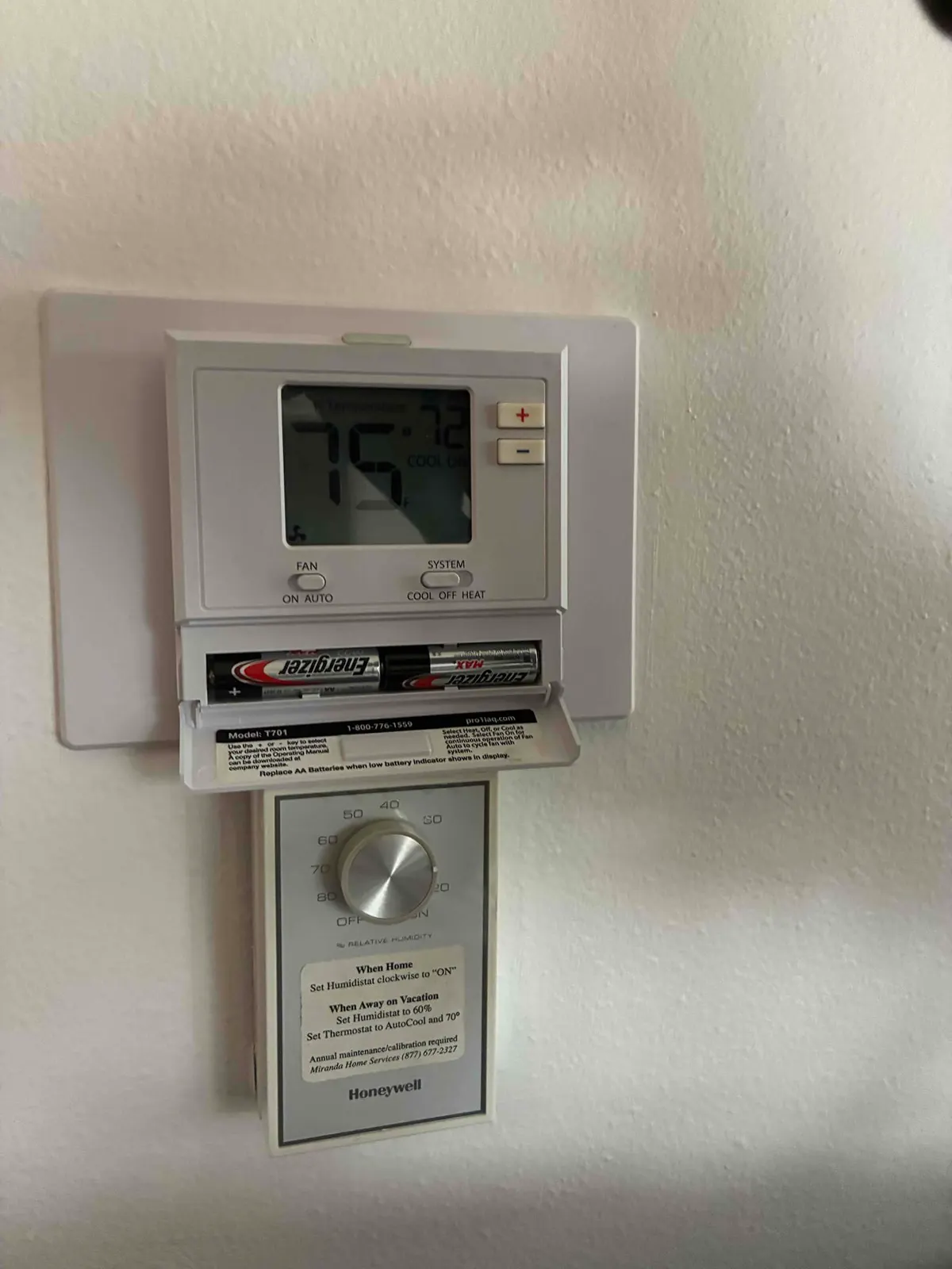 Smart thermostat installed on wall
