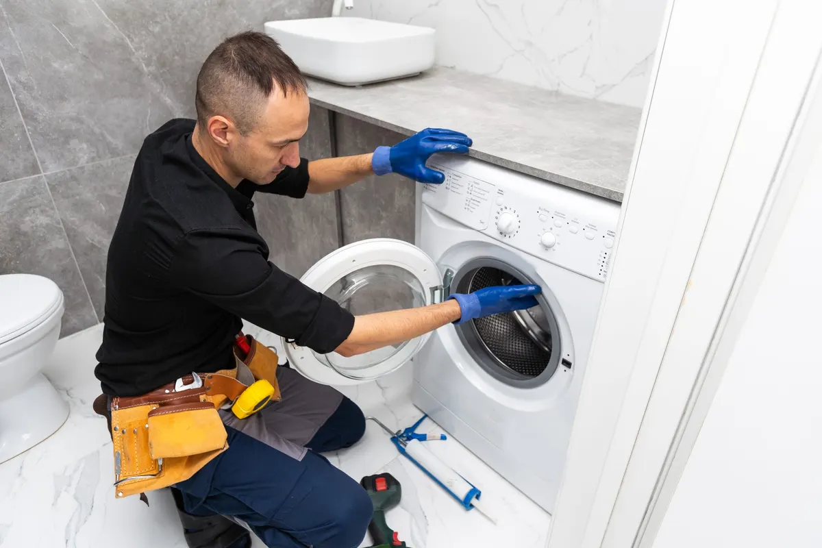 Technician installing a washing machine