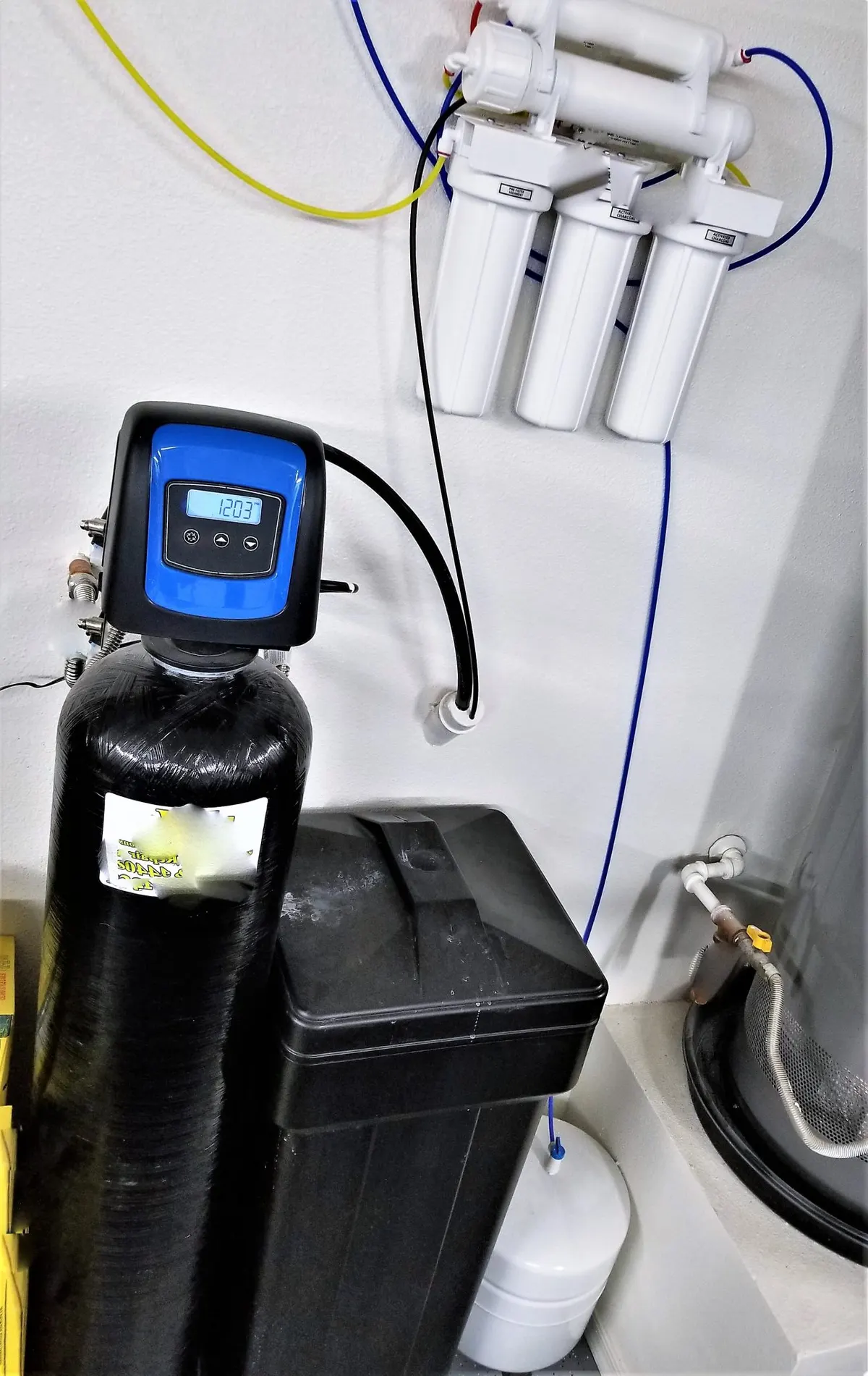 Technician servicing a water softener system
