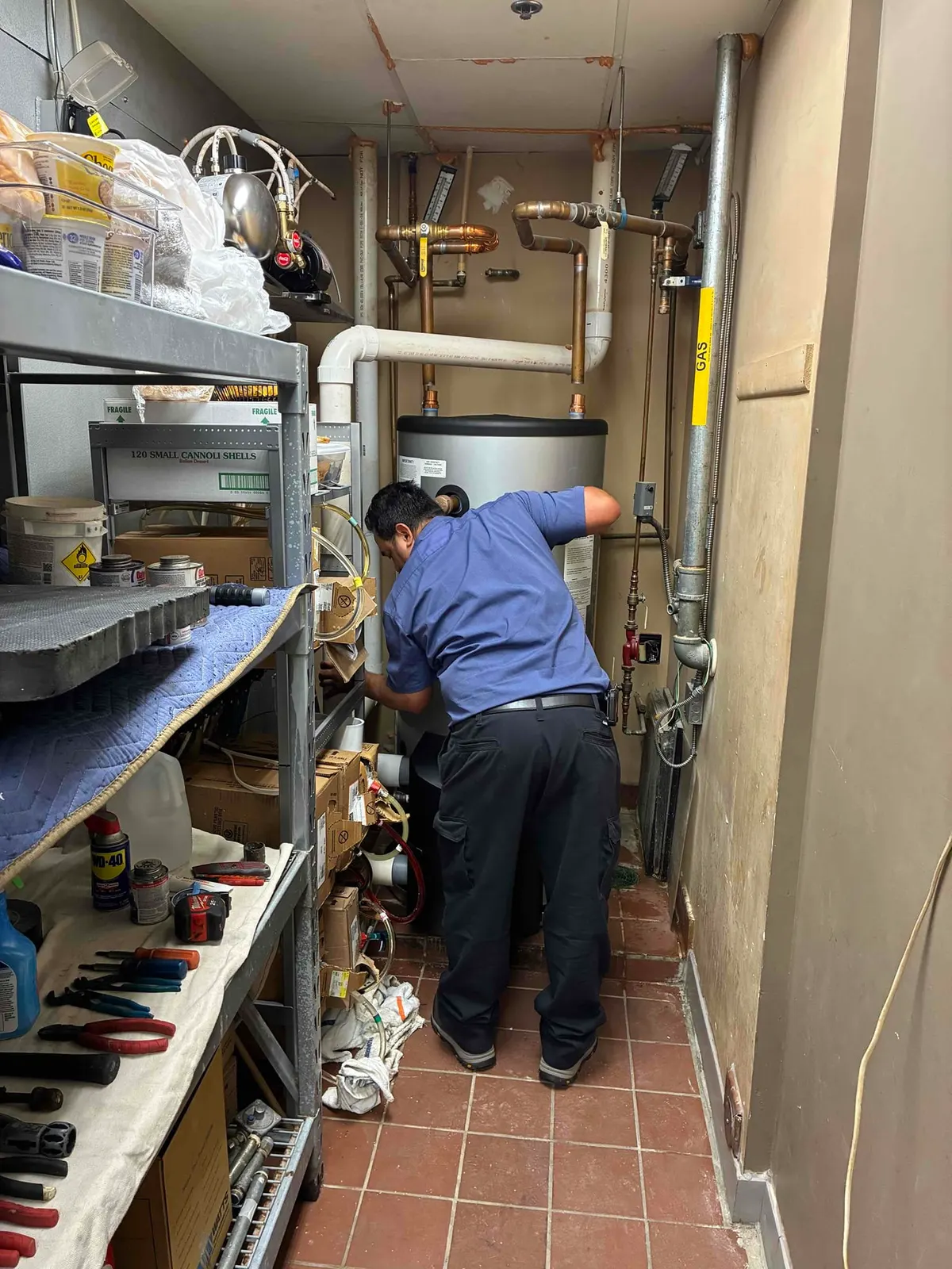 Technician working on a water heater